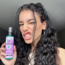 Load image into Gallery viewer, Woman posing with Mane Club's One-Hit Wonder leave-in conditioner spray